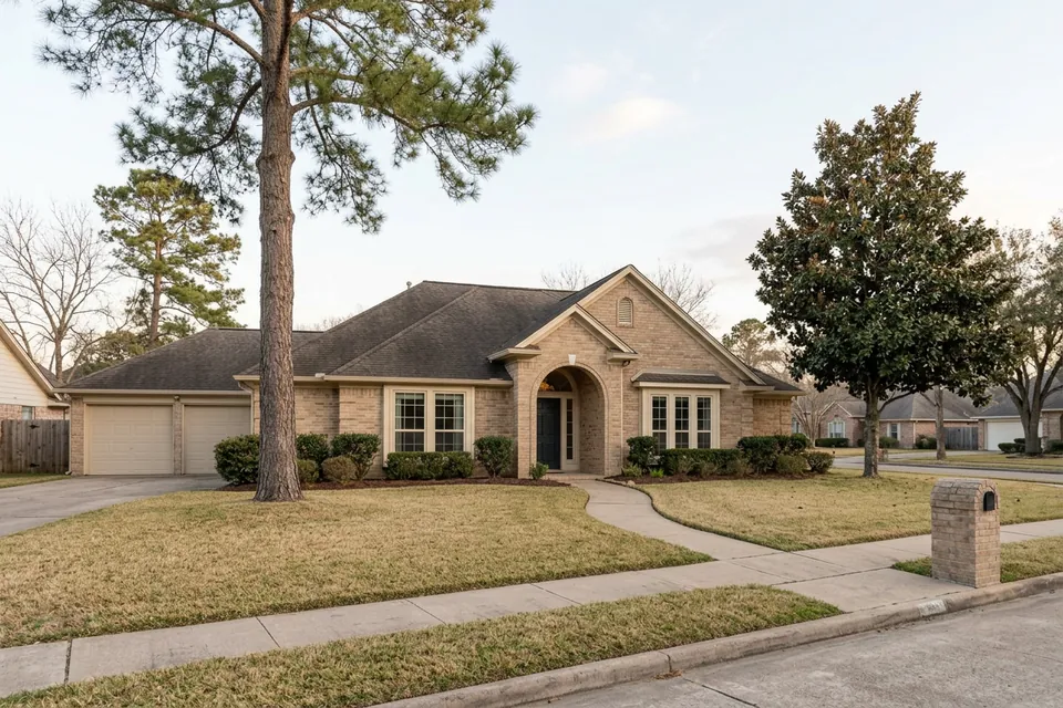 Illustration of a 1980s tan brick house with an arched entry