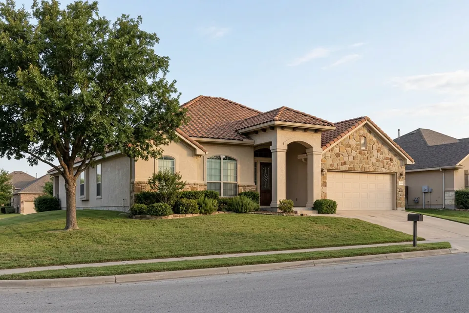 Illustration of a 1990s stucco and stone house