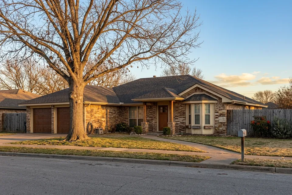 Illustration of a 1980s brown brick ranch house with a bay window
