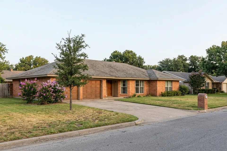 Illustration of a 1970s brick ranch house with a two-car garage