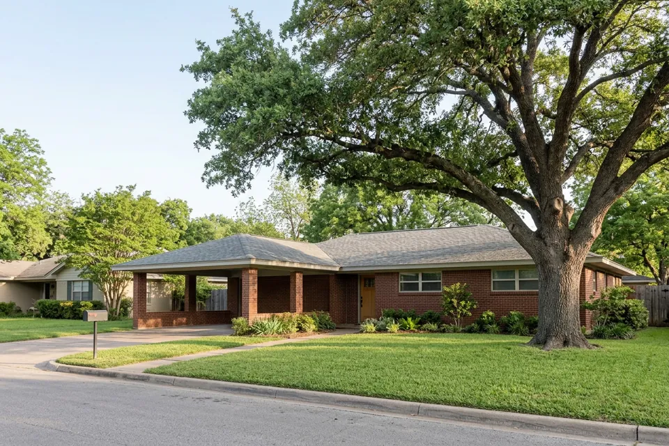 Illustration of a 1960s brick ranch house with a carport