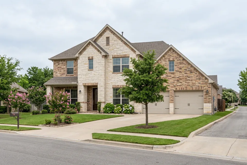 Illustration of a two-story stone and brick suburban house