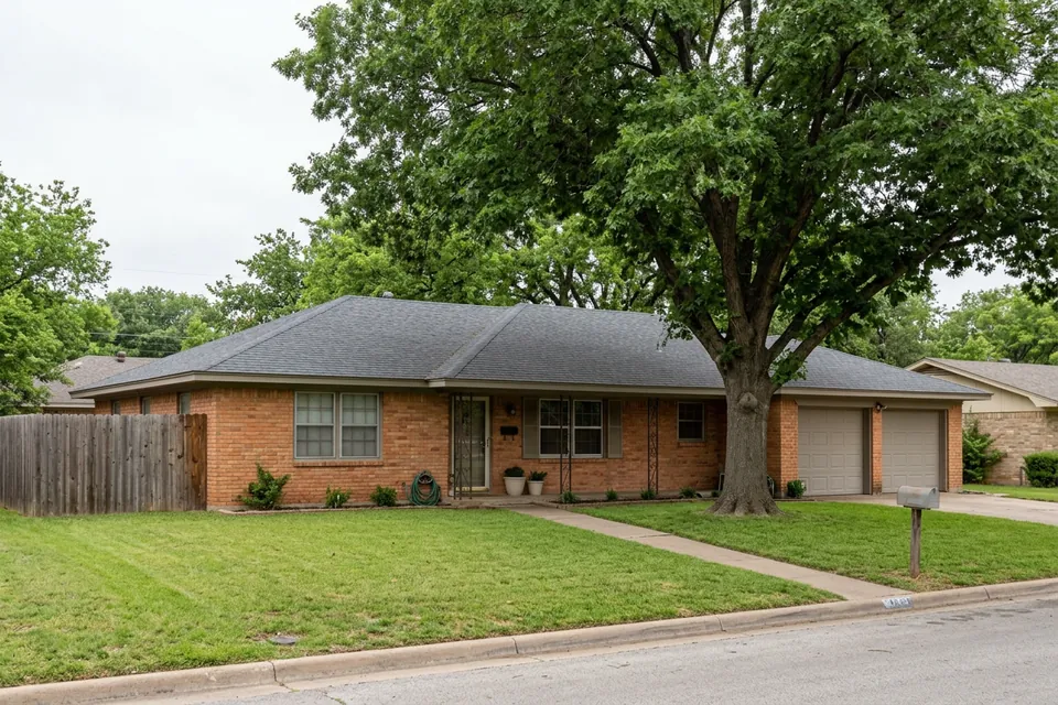 Illustration of a 1970s brick ranch house with a two-car garage