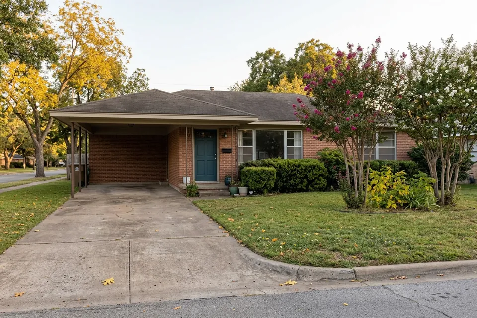 Illustration of a 1960s brick ranch house with a carport