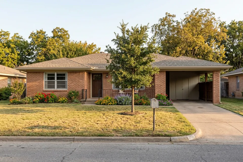 Illustration of a 1960s brick ranch house with a carport