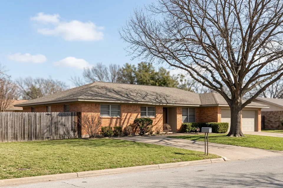 Illustration of a 1970s brick ranch house with a two-car garage