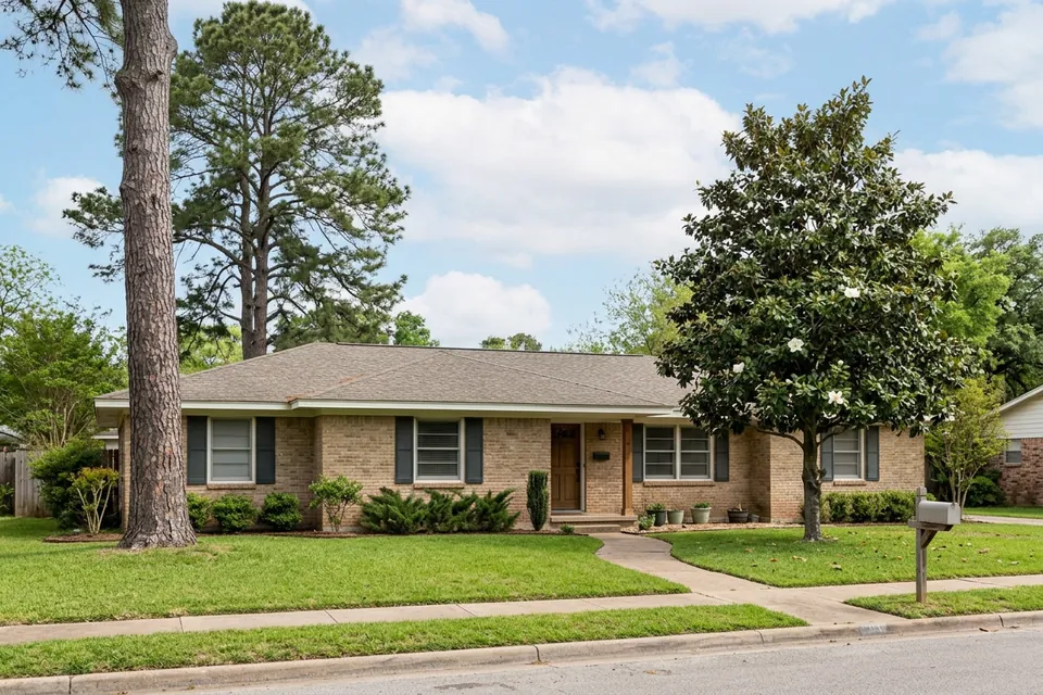 Illustration of a 1970s brick ranch house with shutters