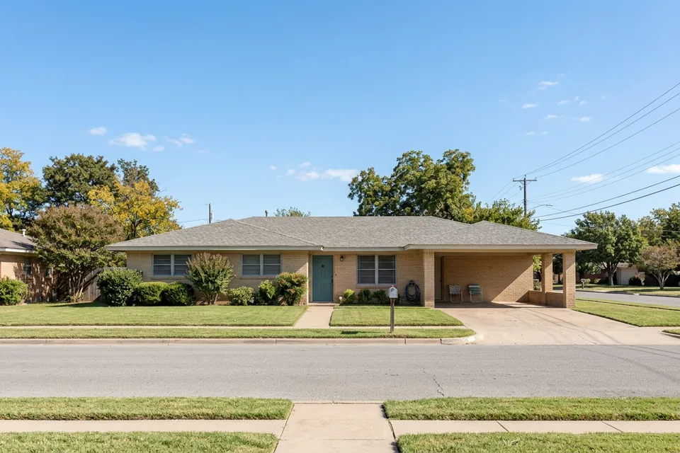 Illustration of a 1960s brick ranch house with a carport