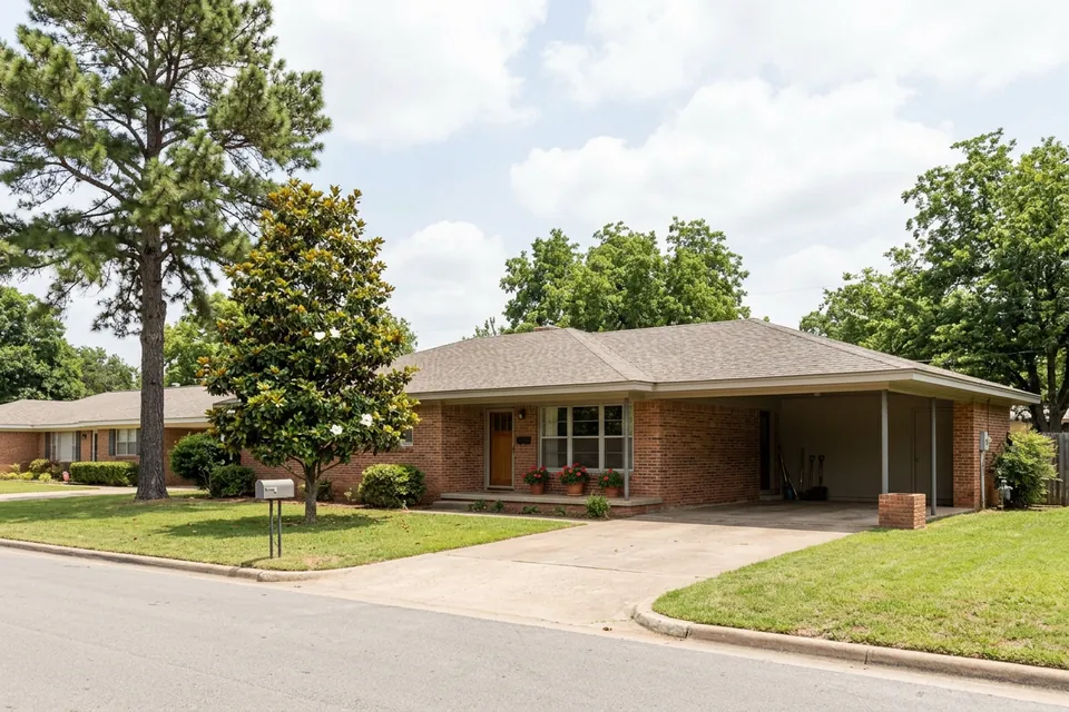 Illustration of a 1960s brick ranch house with a carport