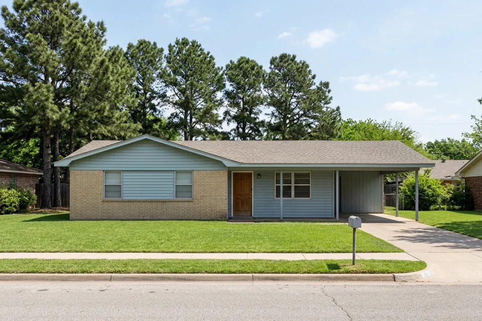 Illustration of a 1980s brick and siding house with a carport