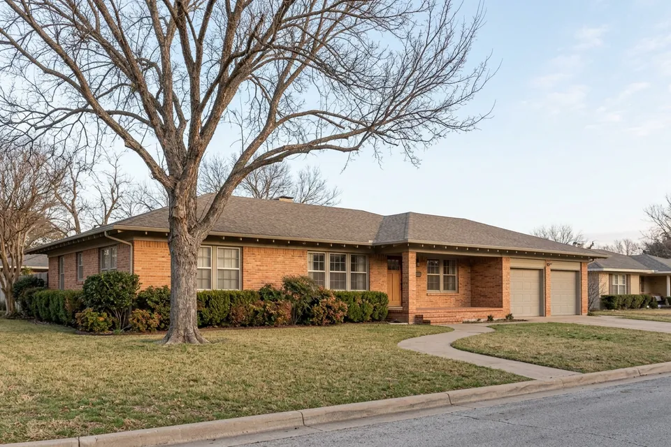 Illustration of a 1970s brick ranch house with a two-car garage