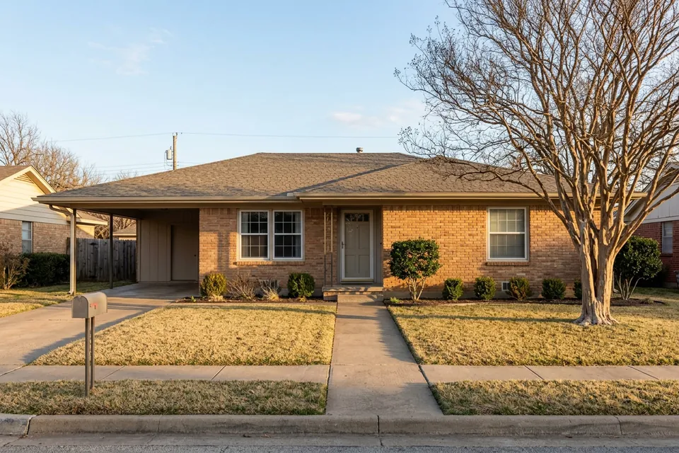 Illustration of a 1960s brick ranch house with a carport